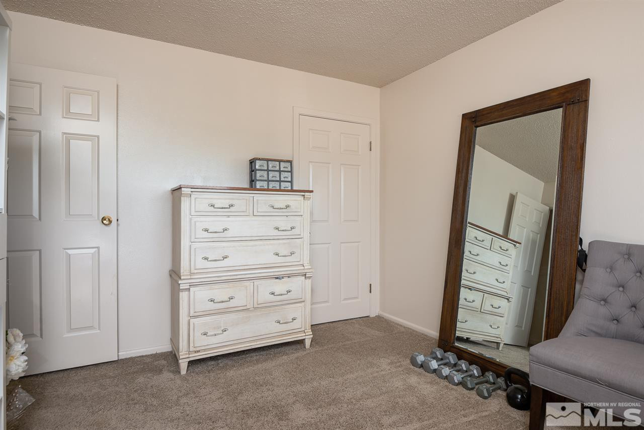 3425 Pierremont Road Reno, NV 89503 - Photo 24 of 28 a view of room with closet and mirror