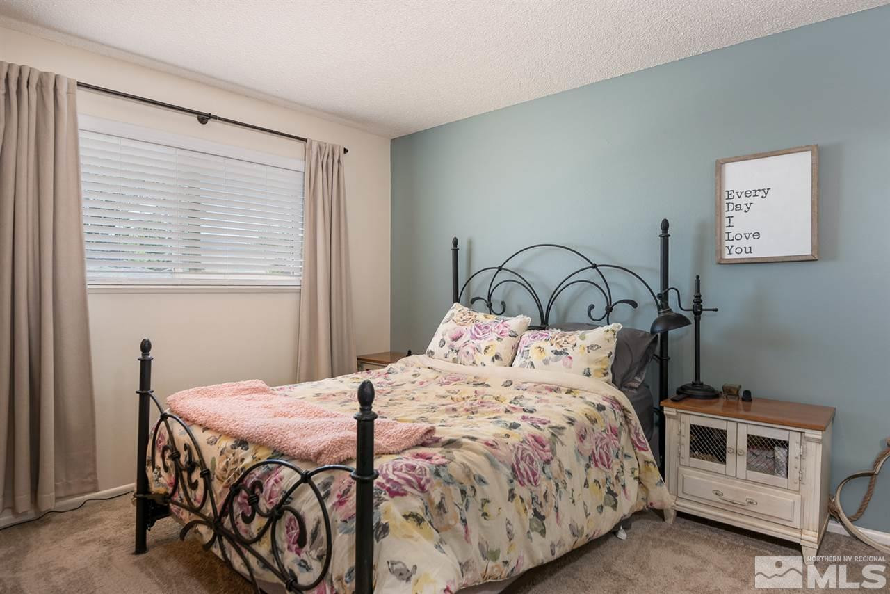 3425 Pierremont Road Reno, NV 89503 - Photo 26 of 28 a bedroom with a bed and a window