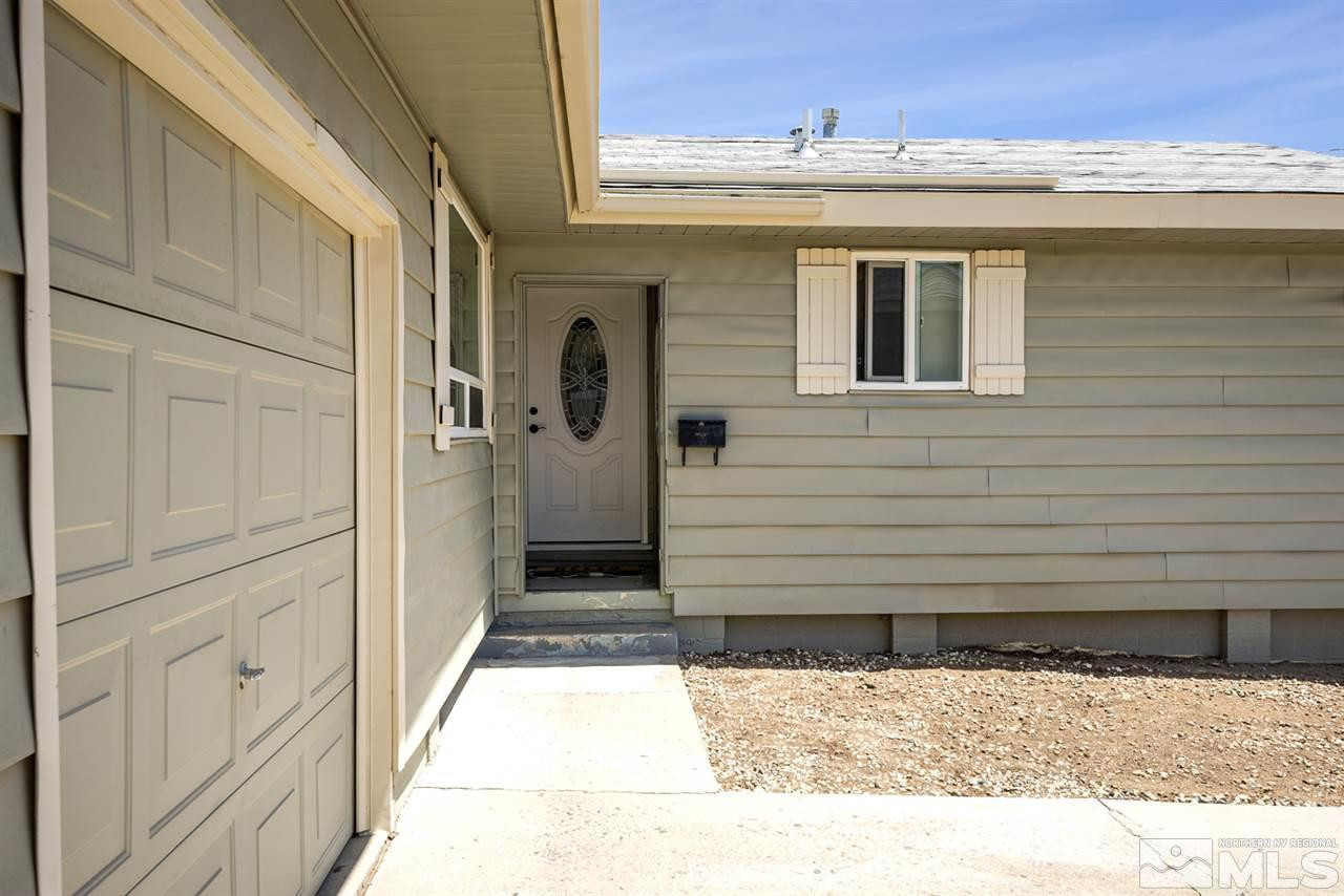 3425 Pierremont Road Reno, NV 89503 - Photo 3 of 28 a view of a house with a wooden door