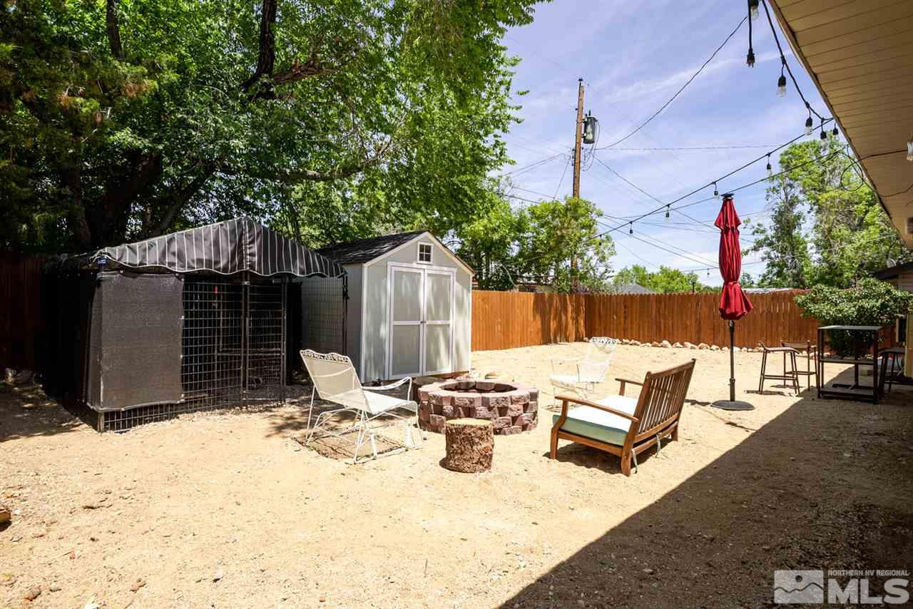 3425 Pierremont Road Reno, NV 89503 - Photo 5 of 28 a view of backyard with a table and chairs under an umbrella