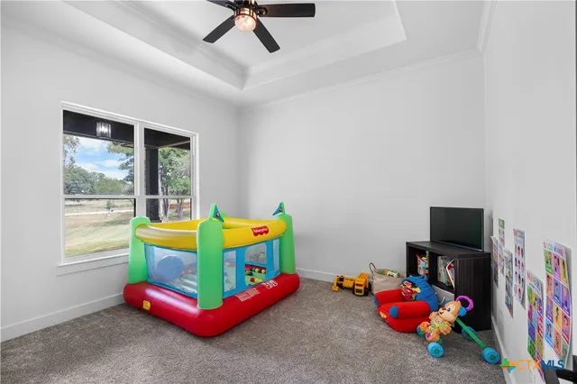 a living room with baby toys