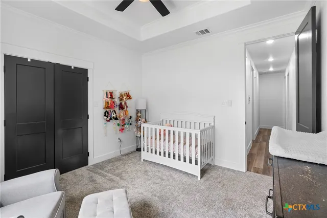 a view of a livingroom with furniture and staircase