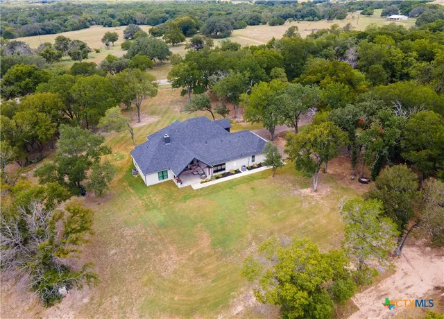 a view of a swimming pool with a yard