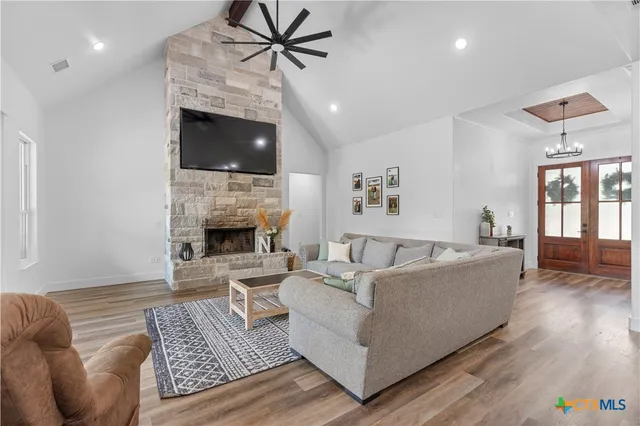 a living room with furniture and a fireplace