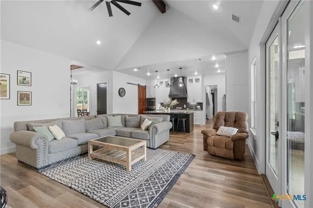 a living room with furniture and a rug