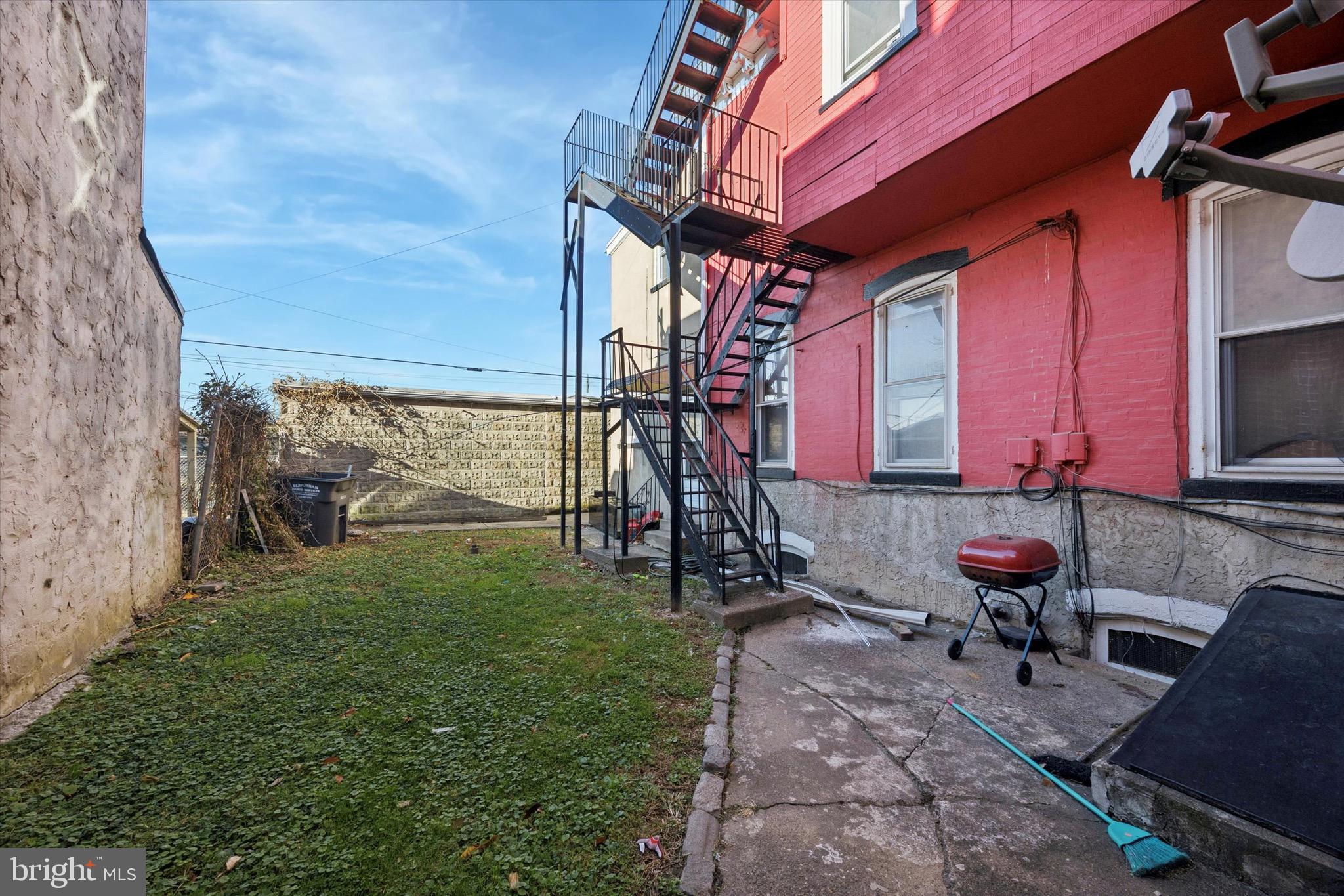 330 Kerlin Street, Unit 3 Chester, PA 19013 - Photo 13 of 15 a view of an chairs and table in patio