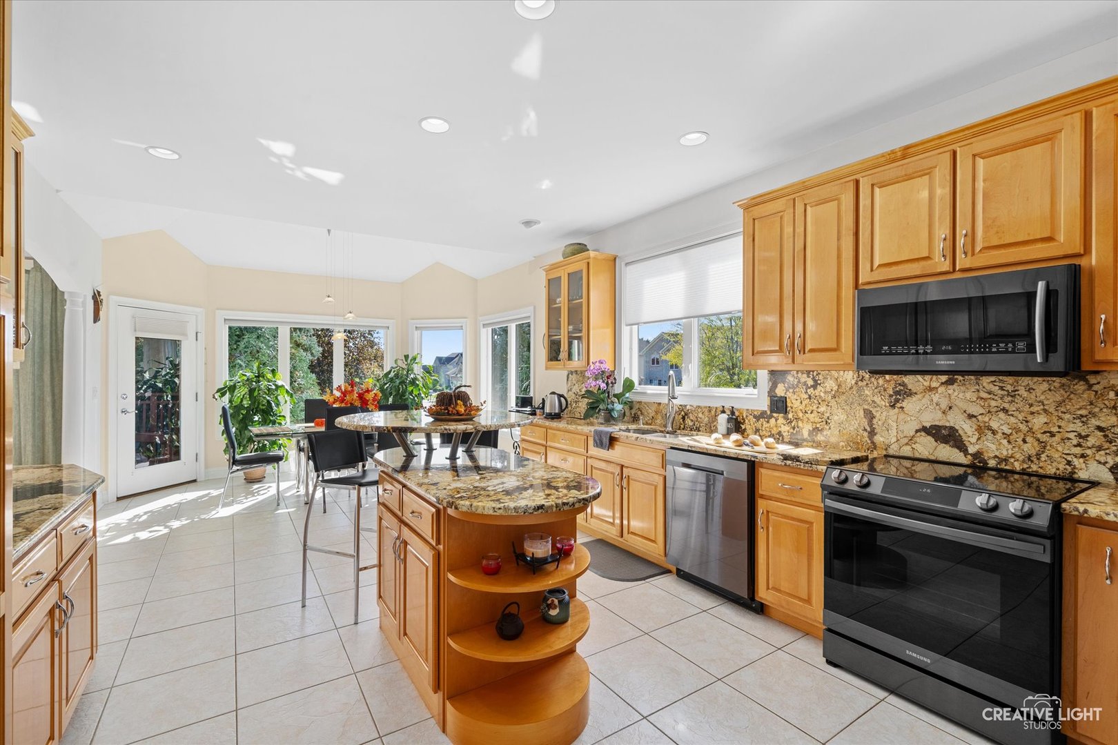 3912 Highknob Circle Naperville, IL 60564 - Photo 13 of 42 a kitchen with stainless steel appliances granite countertop a stove a sink dishwasher a microwave oven with granite countertops and cabinets