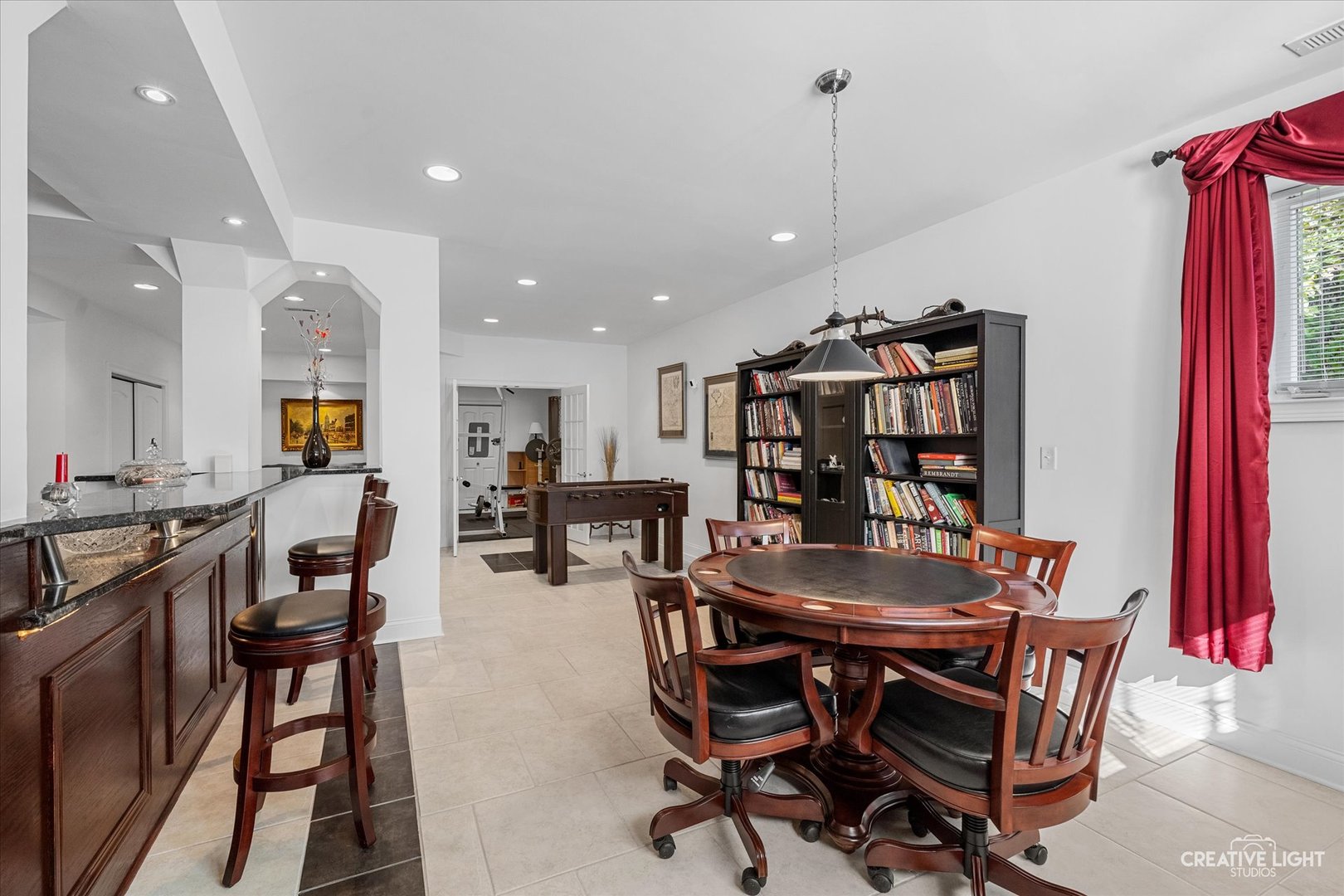 3912 Highknob Circle Naperville, IL 60564 - Photo 31 of 42 a view of a dining room with furniture and a book shelf