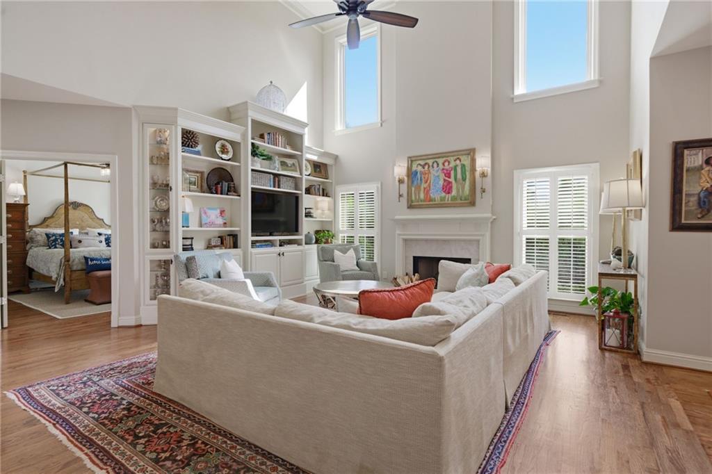 535 Brayford Way Suwanee, GA 30024 - Photo 13 of 55 a living room with furniture a fireplace and a flat screen tv