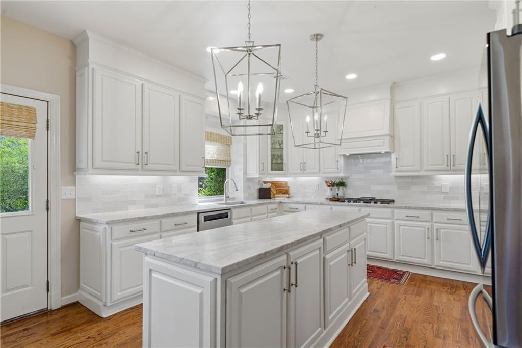 535 Brayford Way Suwanee, GA 30024 - Photo 17 of 55 a kitchen with a sink stainless steel appliances a counter space and a window