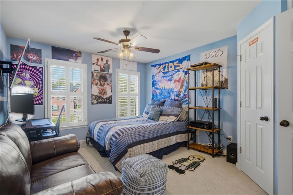 535 Brayford Way Suwanee, GA 30024 - Photo 22 of 55 a bedroom with a bed furniture and a window