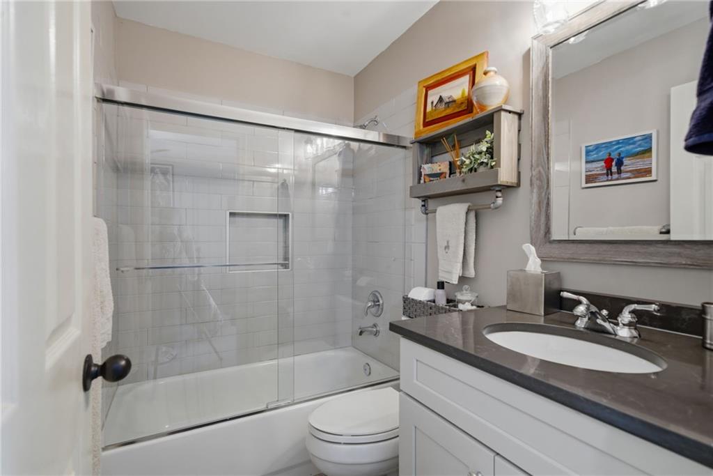 535 Brayford Way Suwanee, GA 30024 - Photo 26 of 55 a bathroom with a granite countertop sink mirror vanity and toilet