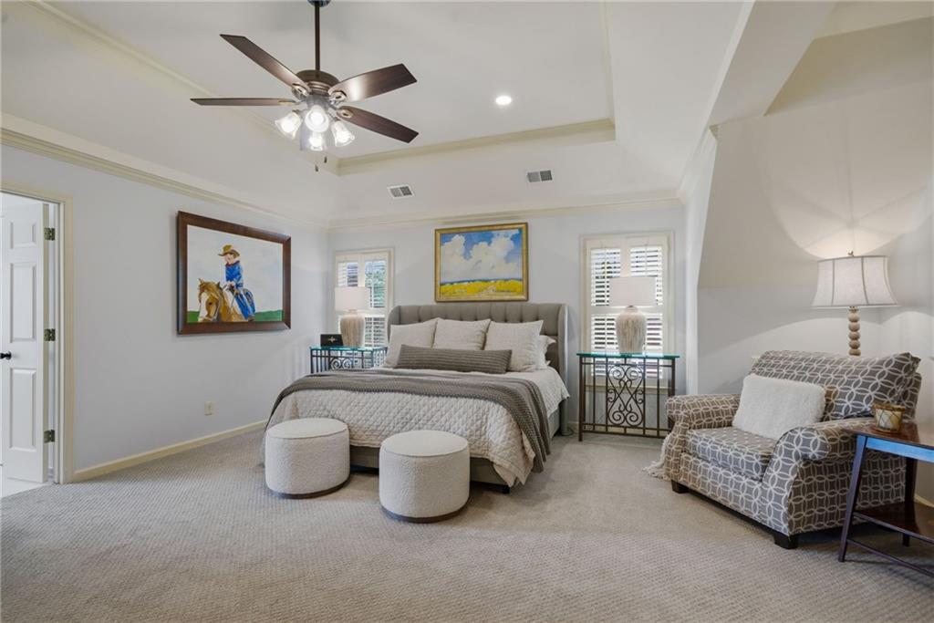 535 Brayford Way Suwanee, GA 30024 - Photo 28 of 55 a bed room with furniture and a chandelier