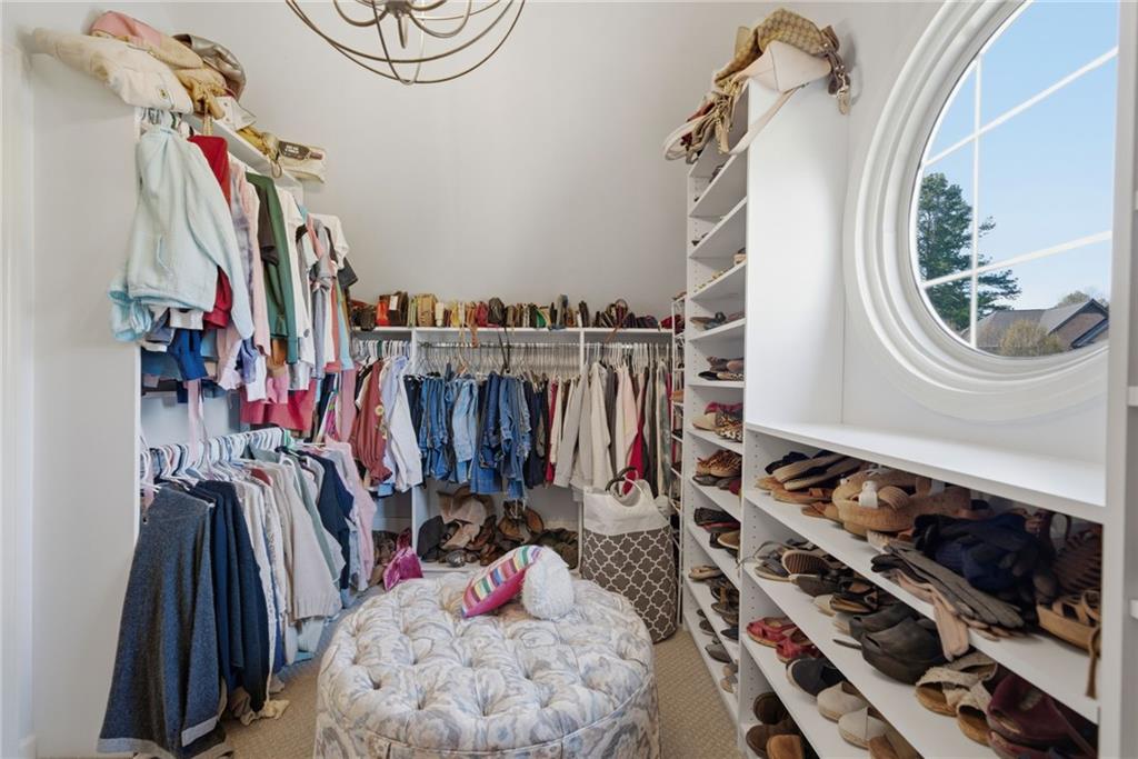 535 Brayford Way Suwanee, GA 30024 - Photo 30 of 55 a view of walk in closet with clothes and shoes