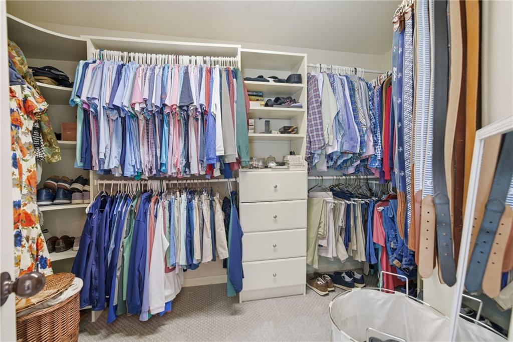 535 Brayford Way Suwanee, GA 30024 - Photo 34 of 55 a view of walk in closet with clothes and shoes