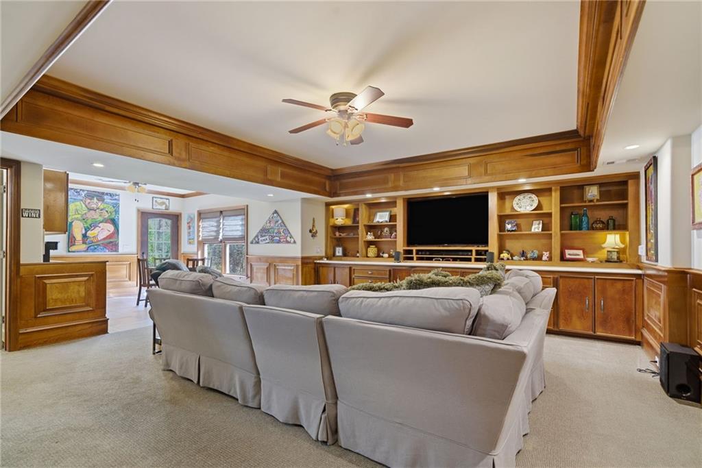 535 Brayford Way Suwanee, GA 30024 - Photo 38 of 55 a living room with furniture and a flat screen tv