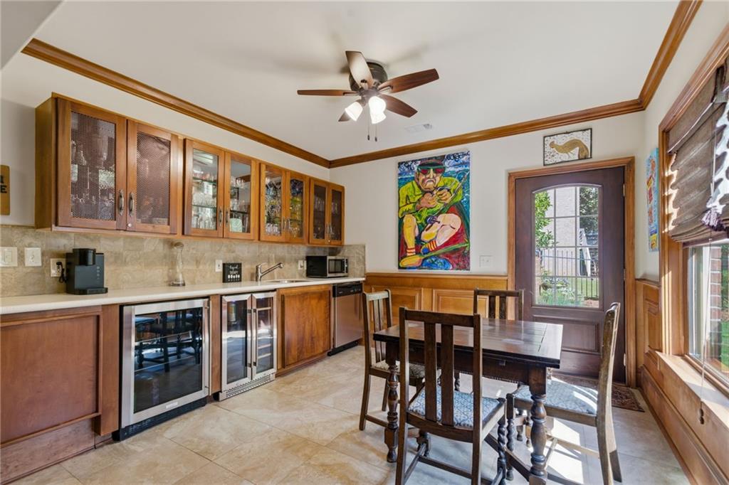 535 Brayford Way Suwanee, GA 30024 - Photo 40 of 55 a view of a dining room with furniture a chandelier and wooden floor
