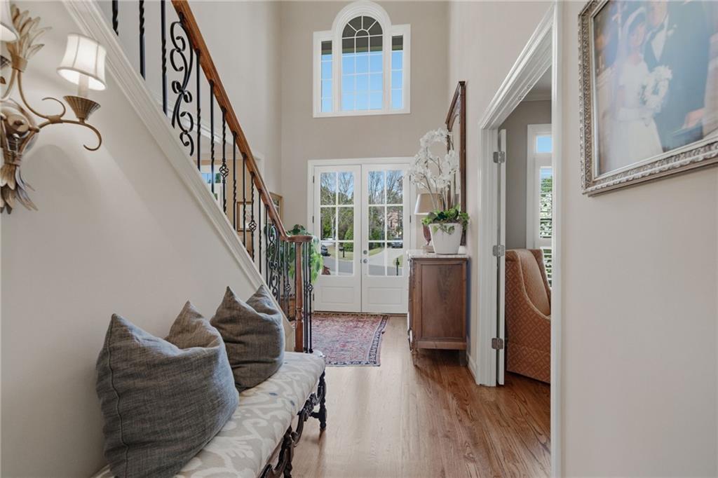 535 Brayford Way Suwanee, GA 30024 - Photo 4 of 55 a living room with furniture and a stairs