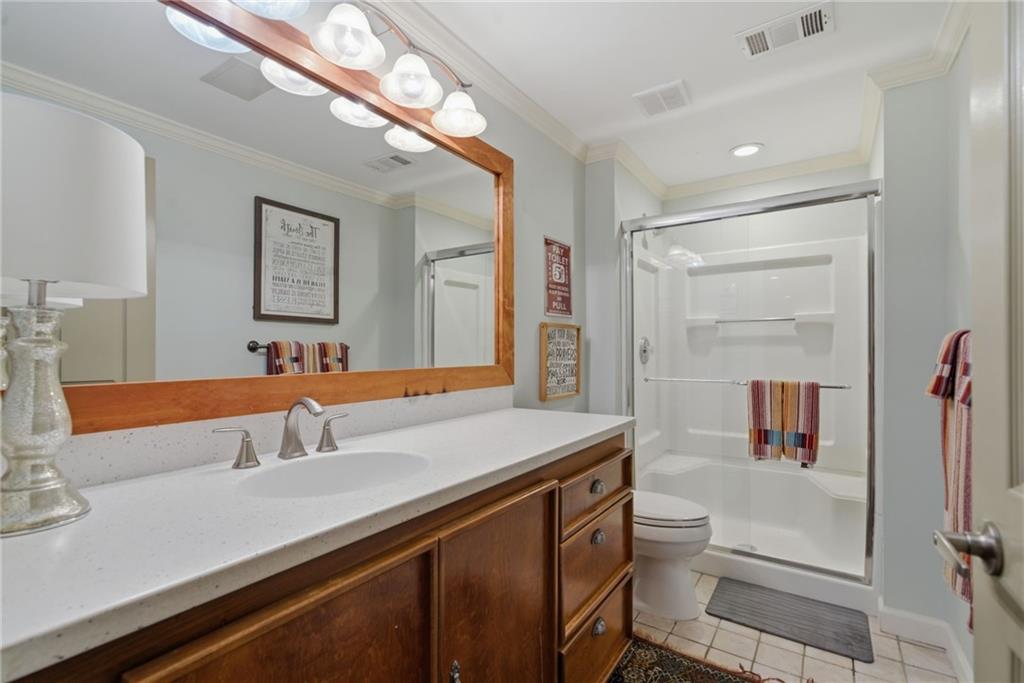 535 Brayford Way Suwanee, GA 30024 - Photo 41 of 55 a bathroom with a sink and a mirror