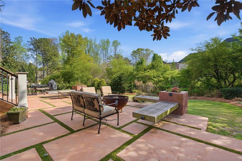 535 Brayford Way Suwanee, GA 30024 - Photo 43 of 55 a view of a backyard with sitting area