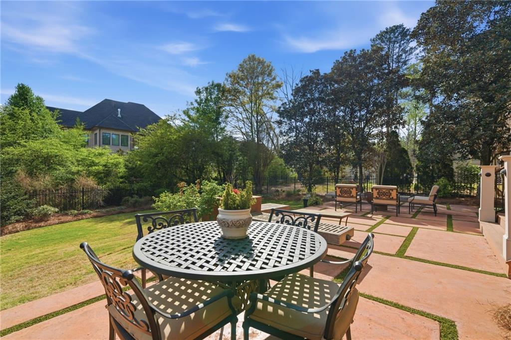 535 Brayford Way Suwanee, GA 30024 - Photo 45 of 55 a view of a patio with a table and chairs