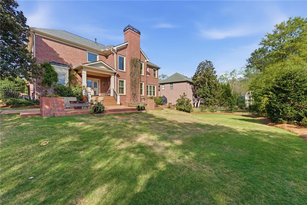 535 Brayford Way Suwanee, GA 30024 - Photo 47 of 55 a front view of a house with a yard