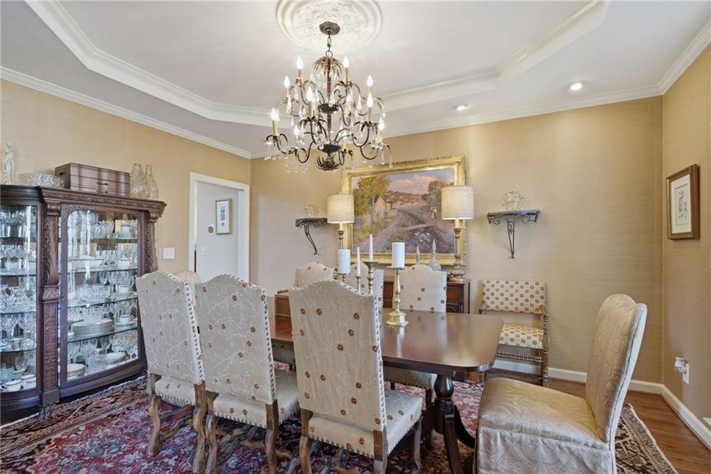 535 Brayford Way Suwanee, GA 30024 - Photo 7 of 55 a view of a dining room with furniture and chandelier