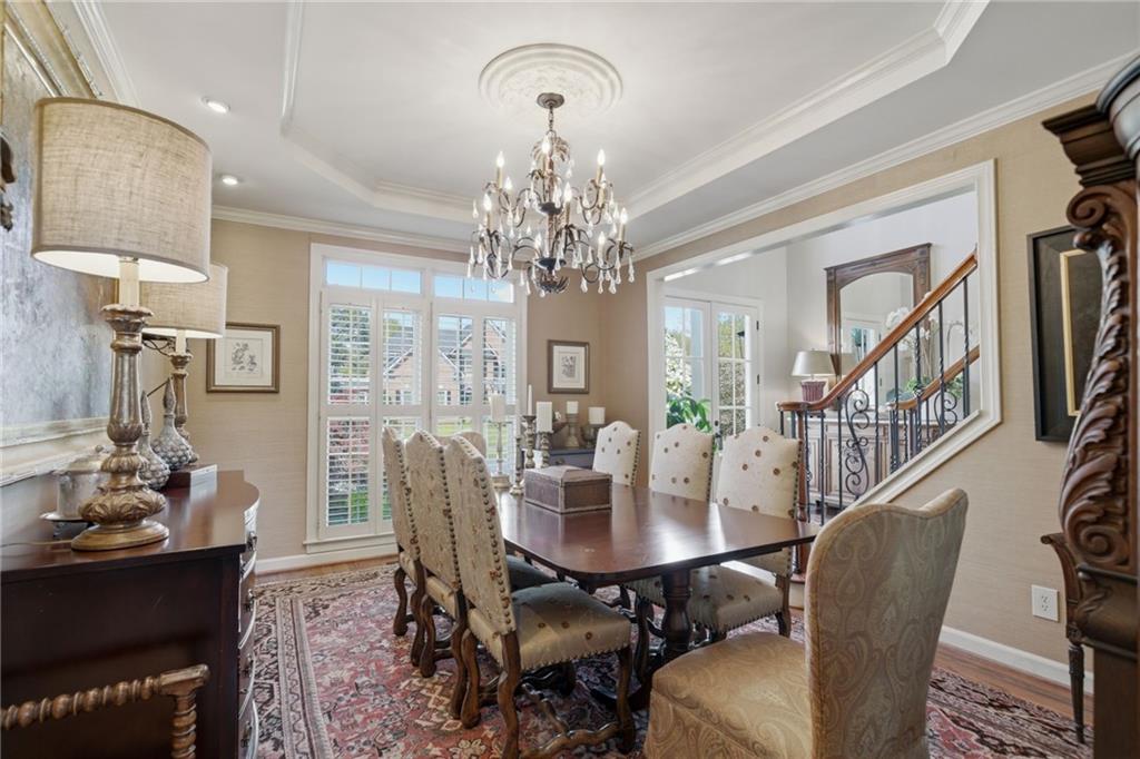 535 Brayford Way Suwanee, GA 30024 - Photo 8 of 55 a view of a dining room with furniture and chandelier
