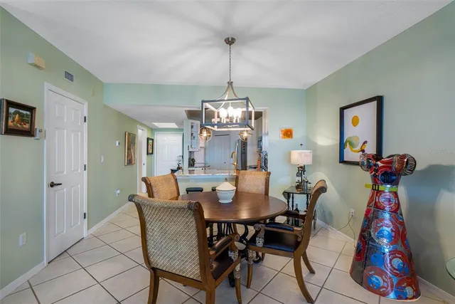 a view of a dining room with furniture wooden floor and a chandelier