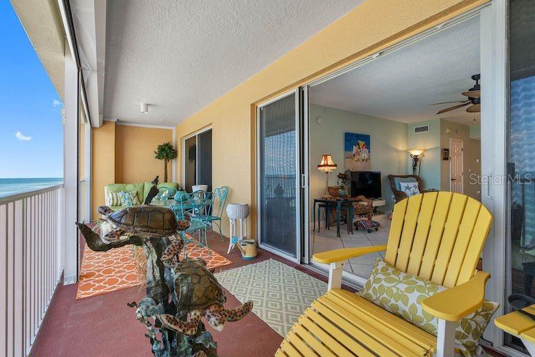 16550 Gulf Boulevard, Unit 545 North Redington Beach, FL 33708 - Photo 21 of 64 a living room with furniture and a floor to ceiling window