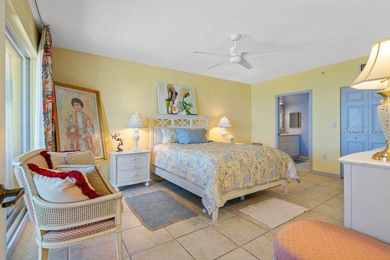 16550 Gulf Boulevard, Unit 545 North Redington Beach, FL 33708 - Photo 23 of 64 a bedroom with a bed and wooden floor