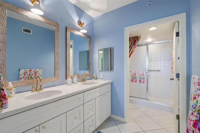 a white toilet sitting next to a shower curtain