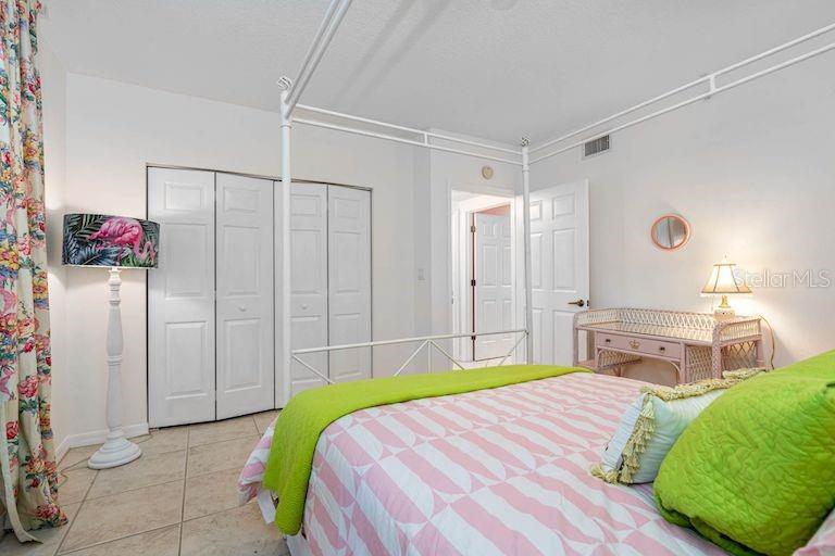 16550 Gulf Boulevard, Unit 545 North Redington Beach, FL 33708 - Photo 30 of 64 a bedroom with a bed and a closet