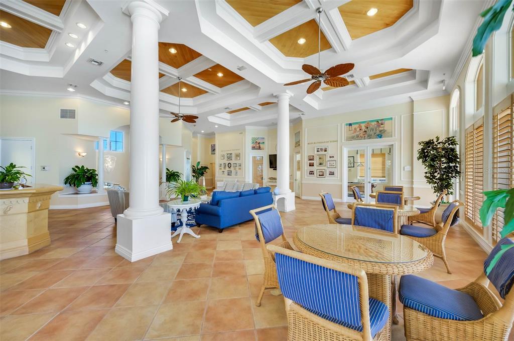 16550 Gulf Boulevard, Unit 545 North Redington Beach, FL 33708 - Photo 37 of 64 a view of a dining room and livingroom with furniture wooden floor and a chandelier