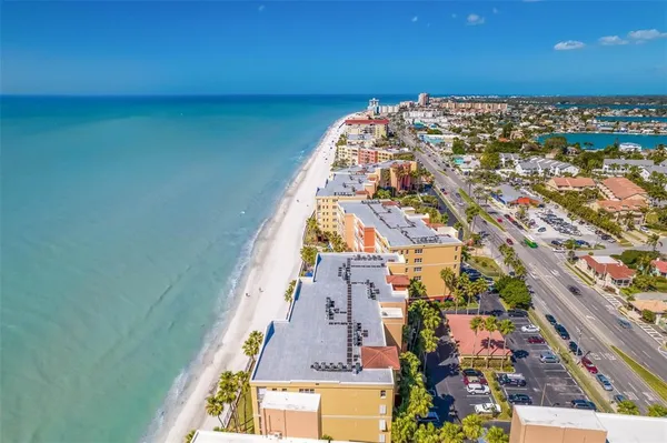 a view of a chairs and table in the balcony