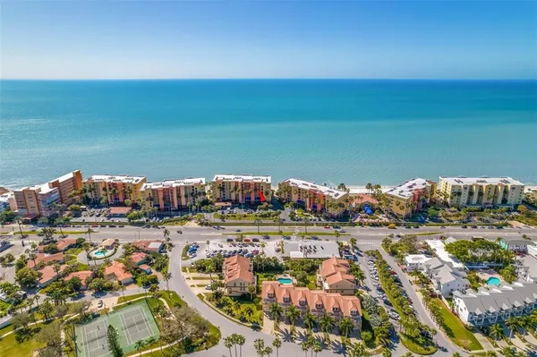 a view of a dining room with furniture and a window