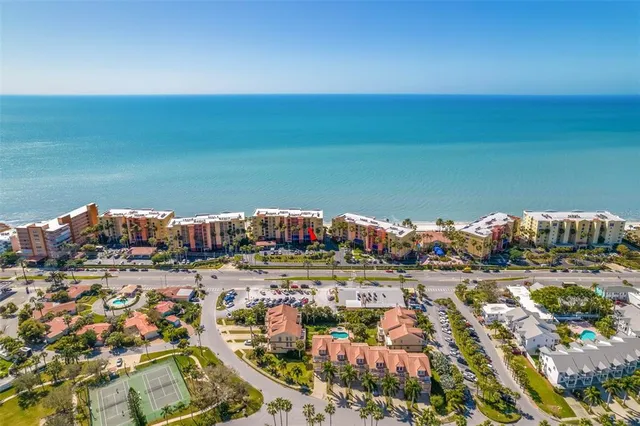 a view of a dining room with furniture and a window