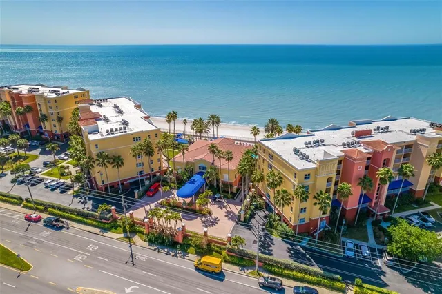 a view of entryway with paintings on the wall