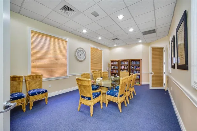 an aerial view of a city with lots of residential buildings and mountain view in back
