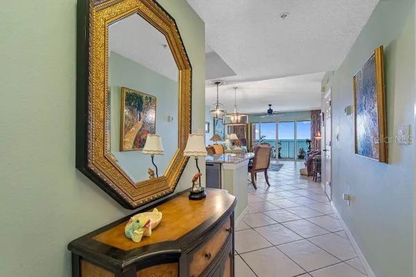 a living room with furniture and a piano