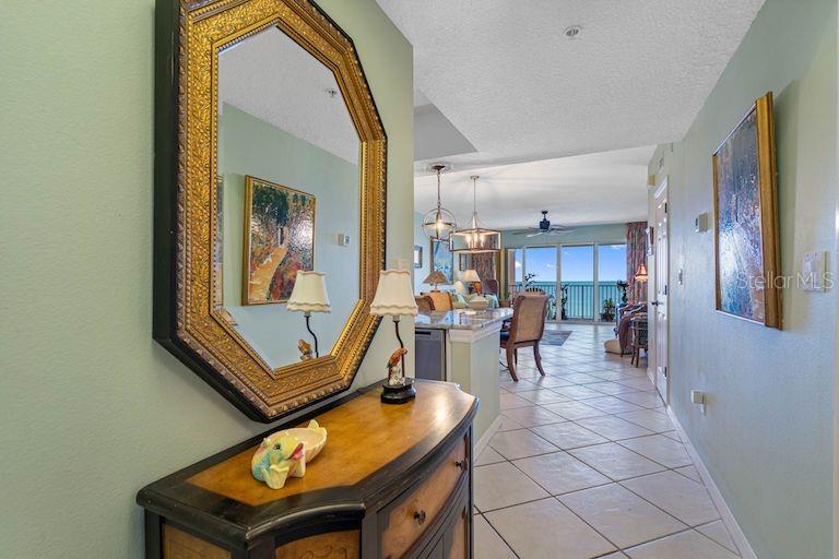 16550 Gulf Boulevard, Unit 545 North Redington Beach, FL 33708 - Photo 5 of 64 a living room with furniture and a piano