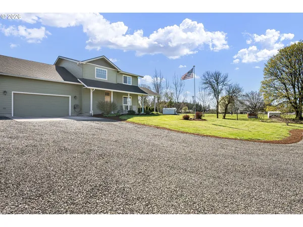 a view of a house with a big yard