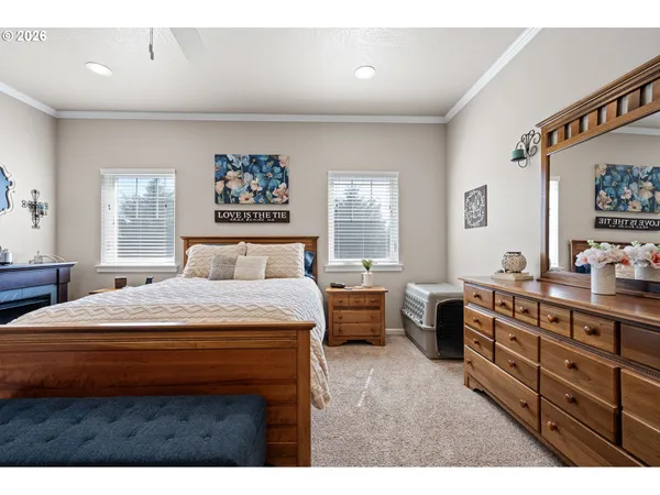 a bedroom with a bed and a dresser