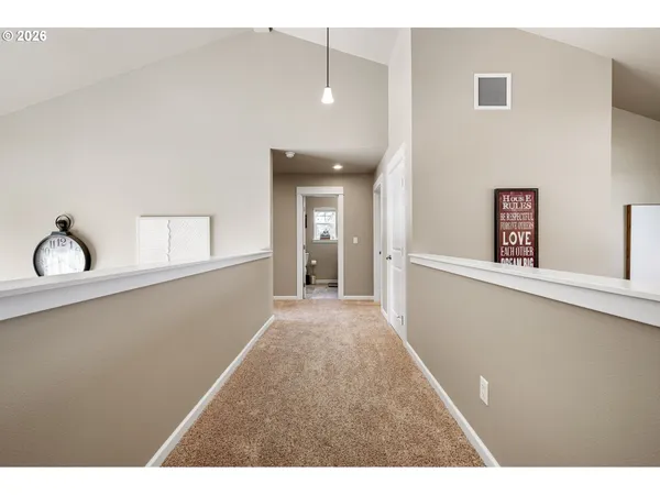 a view of a hallway with windows