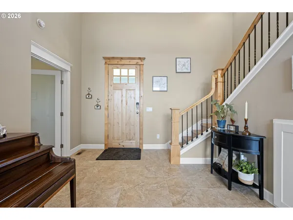 a view of an entryway and livingroom with furniture