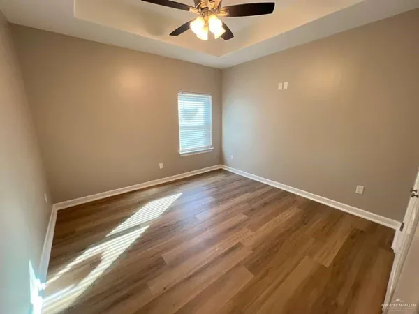 a view of room with window and ceiling fan