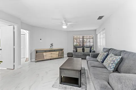 a living room with furniture and a window