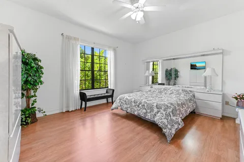 a bedroom with a large bed and a window