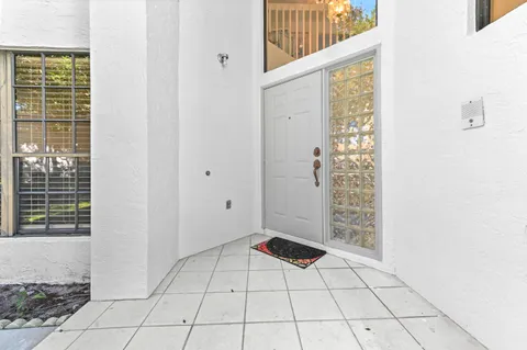 a view of an empty room with windows