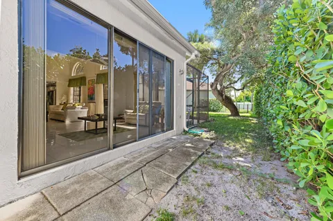 a view of a house with a backyard